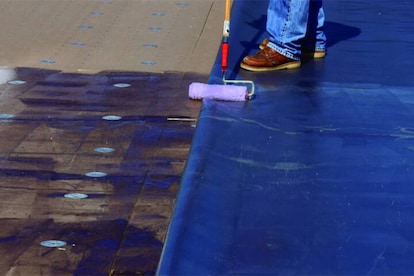 GAF Worker applying Insulation to a deck